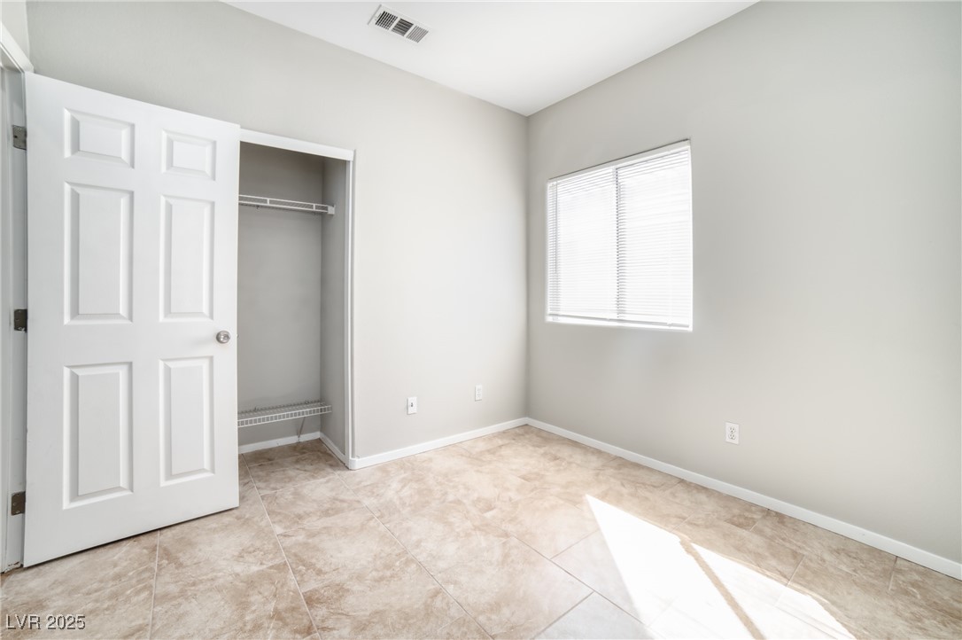 4020 Spring Line Street North Las Vegas, NV 89032 - Photo 11 of 29 Unfurnished bedroom featuring a closet and baseboards