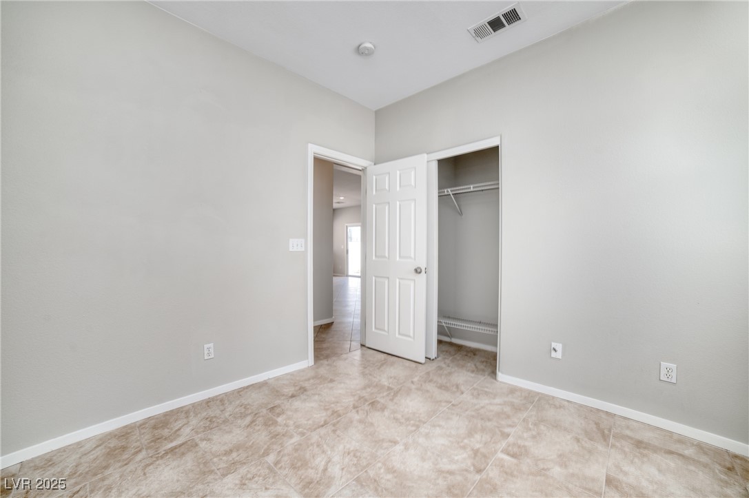 4020 Spring Line Street North Las Vegas, NV 89032 - Photo 12 of 29 Unfurnished bedroom with baseboards and a closet