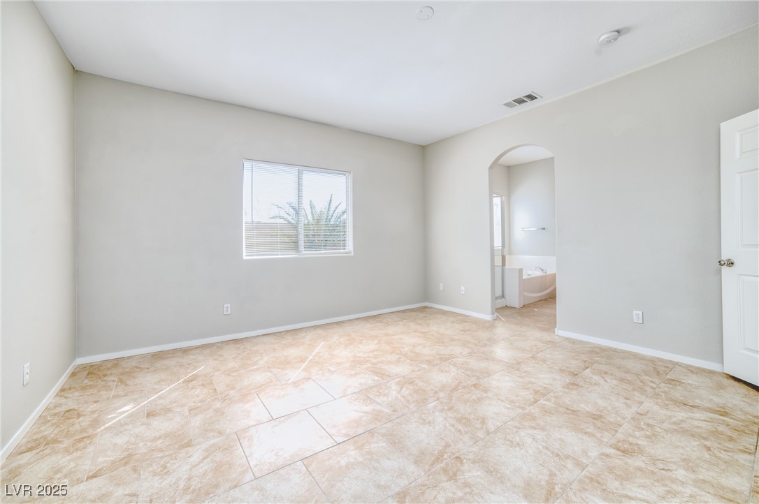4020 Spring Line Street North Las Vegas, NV 89032 - Photo 15 of 29 Unfurnished room with arched walkways and baseboards