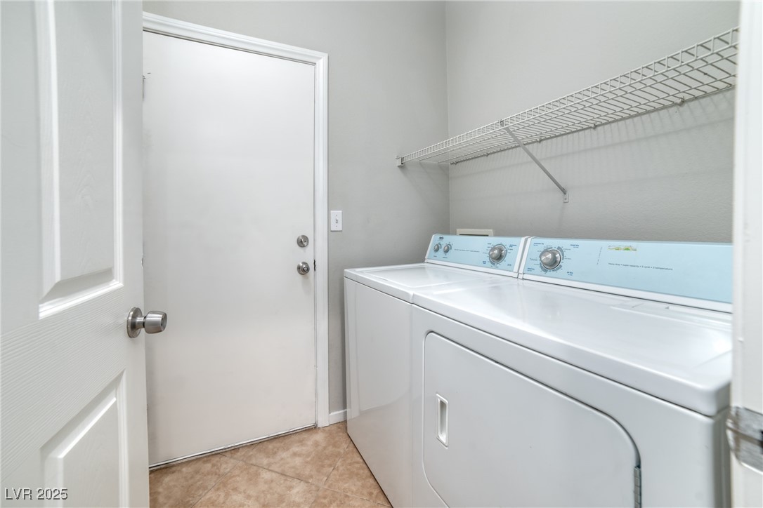 4020 Spring Line Street North Las Vegas, NV 89032 - Photo 20 of 29 Laundry area with washing machine and clothes dryer and light tile patterned floors
