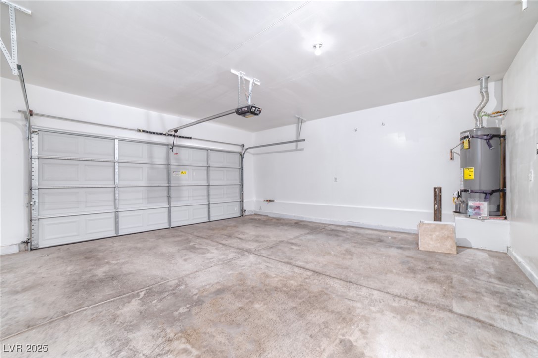 4020 Spring Line Street North Las Vegas, NV 89032 - Photo 27 of 29 Garage with secured water heater and a garage door opener