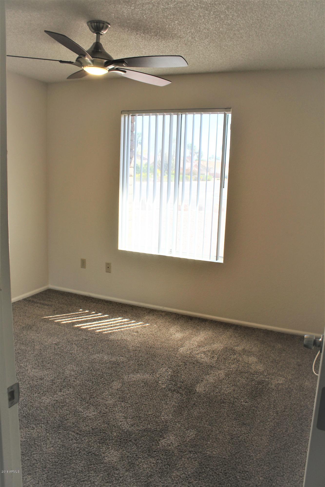 5940 East Spring Road Scottsdale, AZ 85254 - Photo 15 of 23 a view of an empty room with a window