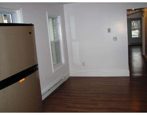 19 Burrell Street Boston, MA 02119 - Photo 17 of 20 a view of hallway with wooden floor