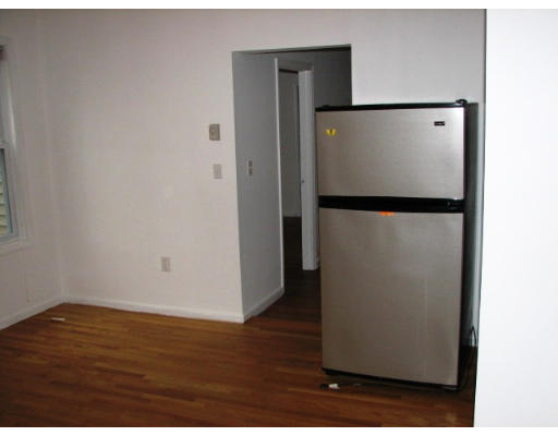 19 Burrell Street Boston, MA 02119 - Photo 5 of 20 a view of a refrigerator in kitchen