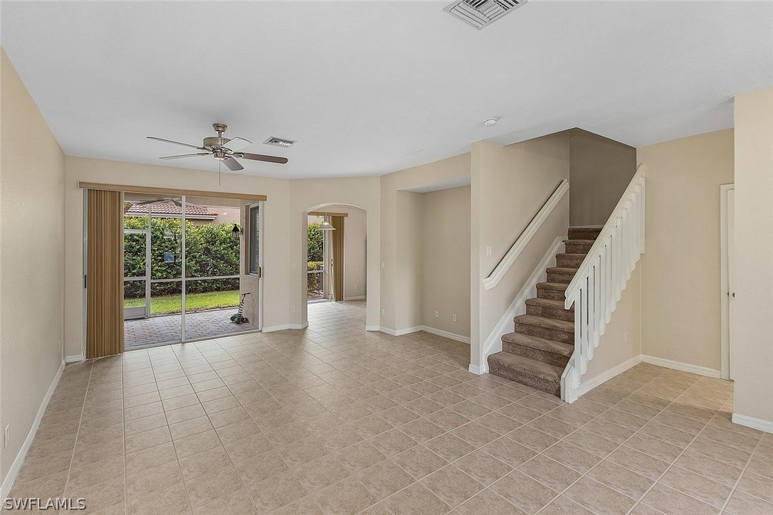 17547 Cherry Ridge Lane Fort Myers, FL 33967 - Photo 3 of 20 a view of an empty room with wooden floor and a window