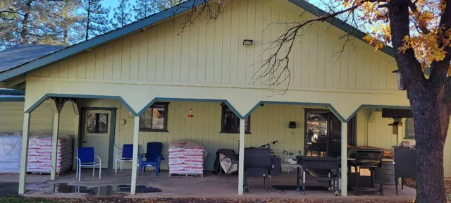 a front view of a house with outdoor seating