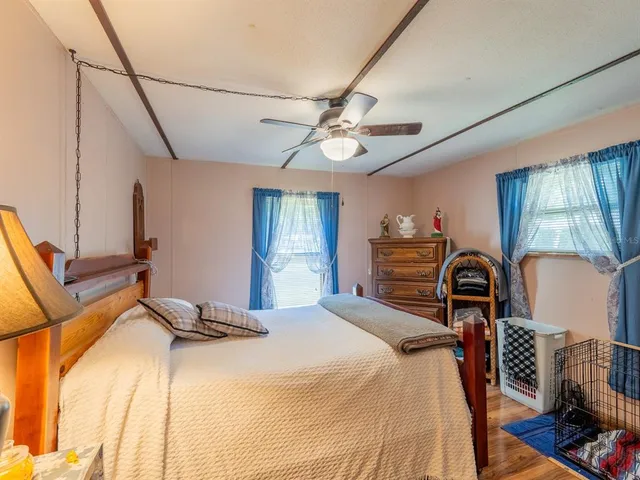 a bedroom with a bed and dresser