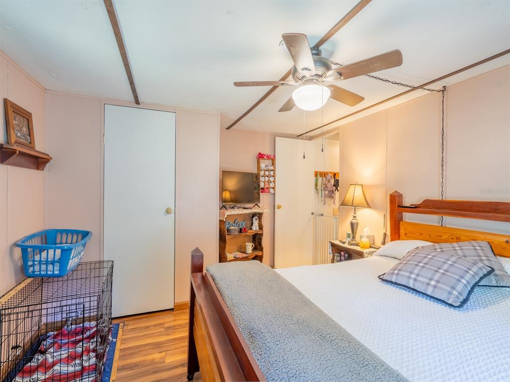 15429 Northeast 38th Court Citra, FL 32113 - Photo 17 of 53 a bedroom with a bed and dresser