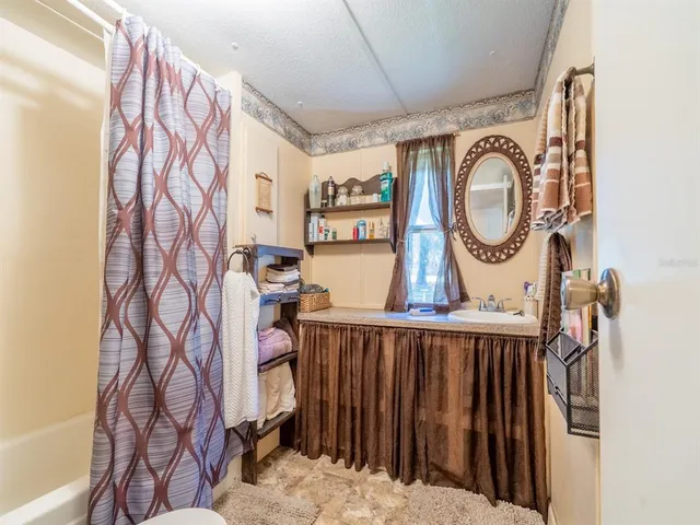 a bathroom with a bathtub and shower