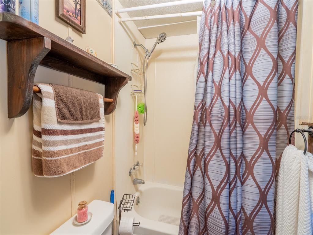 15429 Northeast 38th Court Citra, FL 32113 - Photo 20 of 53 a bathroom with a bathtub and shower
