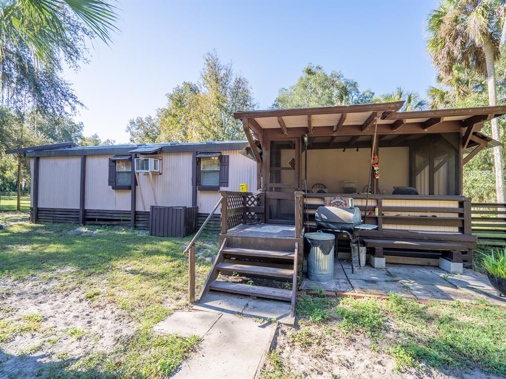 15429 Northeast 38th Court Citra, FL 32113 - Photo 23 of 53 a view of a backyard with sitting area