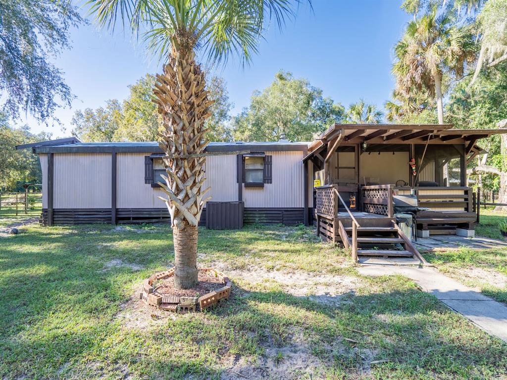15429 Northeast 38th Court Citra, FL 32113 - Photo 24 of 53 a front view of a house with garden