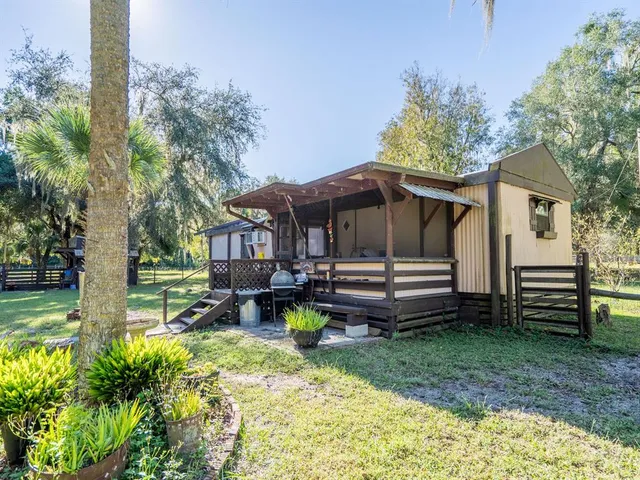 a view of a backyard with a garden and plants