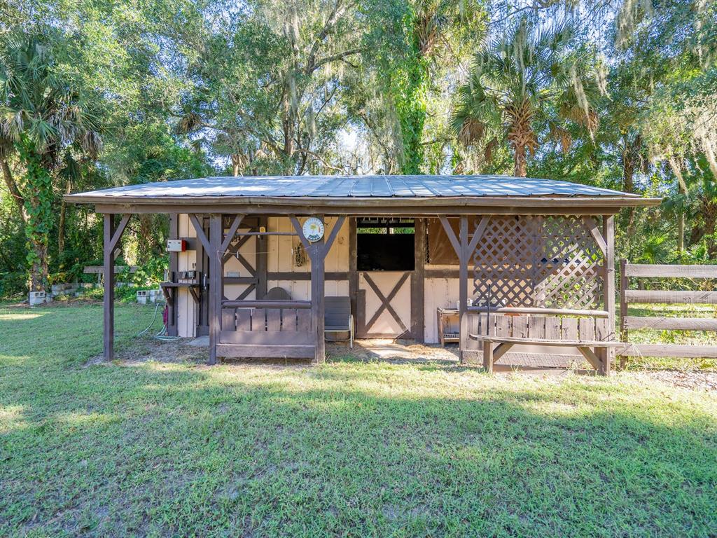 15429 Northeast 38th Court Citra, FL 32113 - Photo 26 of 53 a view of a backyard with a garden and plants
