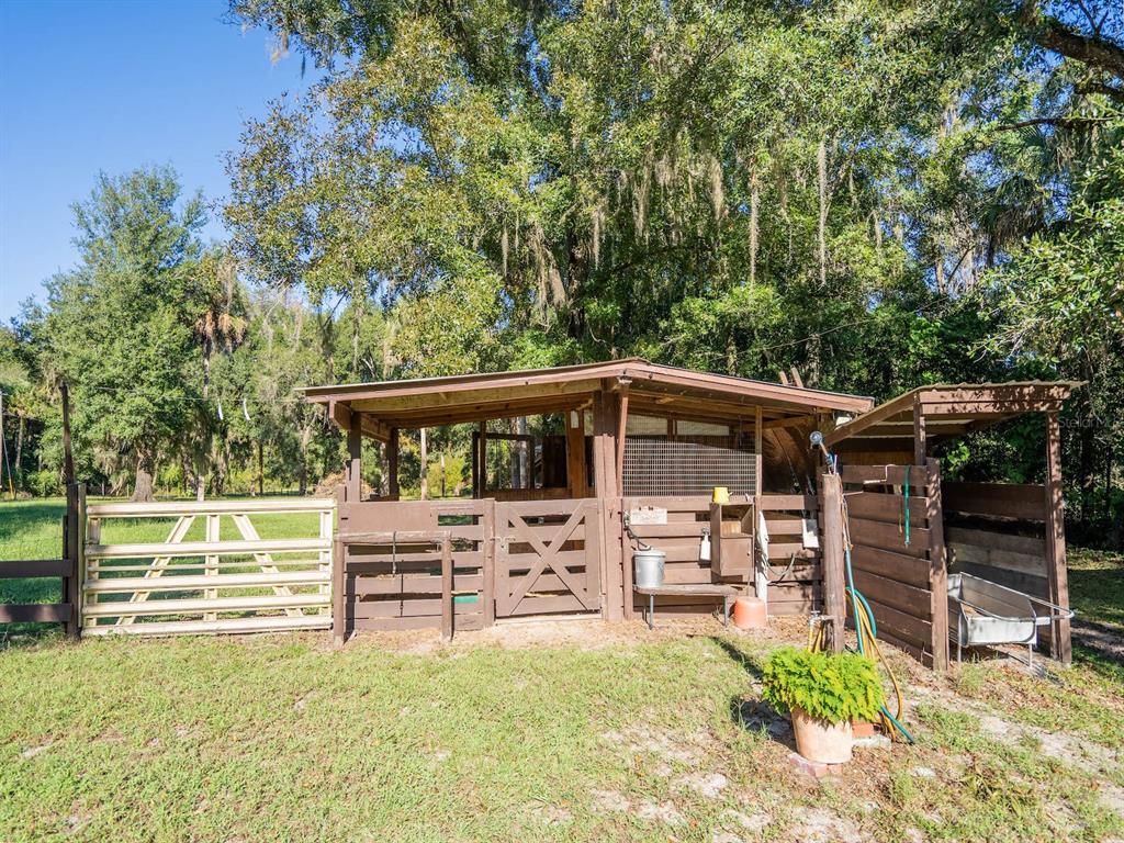 15429 Northeast 38th Court Citra, FL 32113 - Photo 32 of 53 a view of a chair and table on the garden