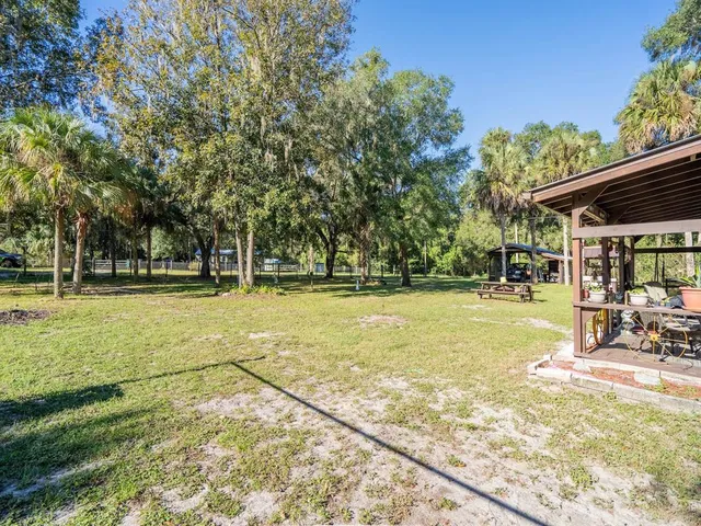 a view of a car park in front of a house