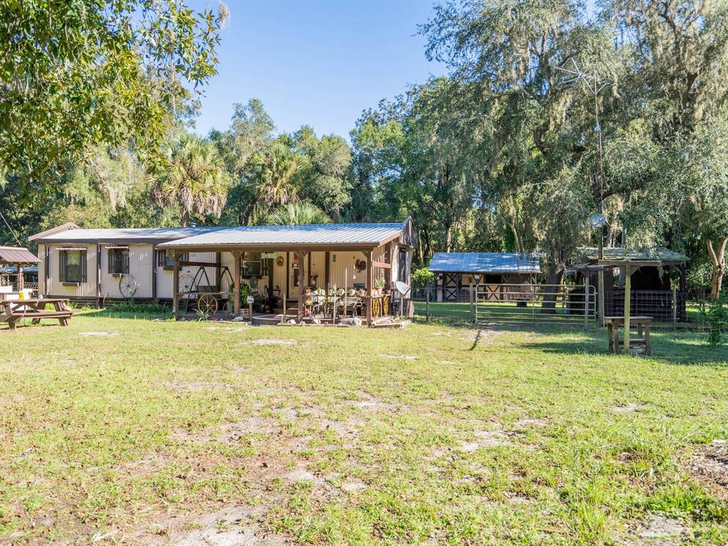15429 Northeast 38th Court Citra, FL 32113 - Photo 36 of 53 a view of a house with swimming pool and a yard