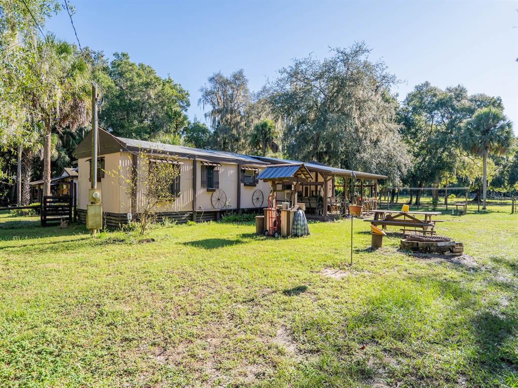 15429 Northeast 38th Court Citra, FL 32113 - Photo 37 of 53 a view of a house with backyard patio and swimming pool