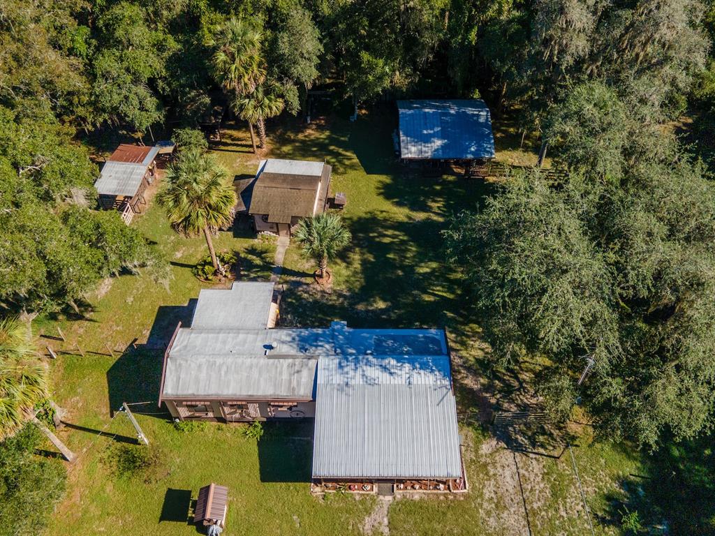 15429 Northeast 38th Court Citra, FL 32113 - Photo 51 of 53 an aerial view of a house with garden space and street view