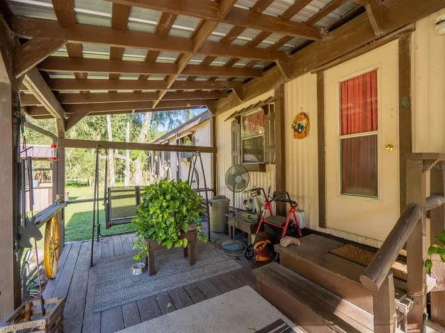 a room with lots of potted plants