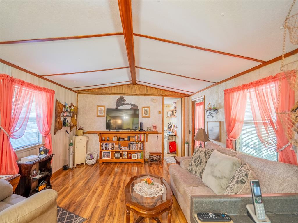 15429 Northeast 38th Court Citra, FL 32113 - Photo 9 of 53 a living room with furniture and a large window
