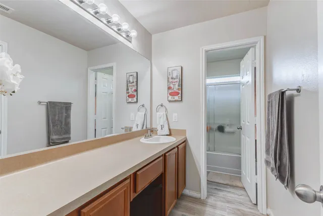 a spacious bedroom with a bed and a window