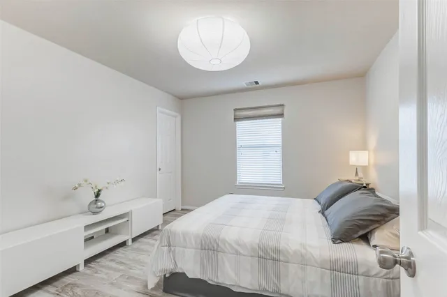 a view of backyard of house with outdoor seating and green space