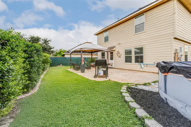 a bedroom with two beds and a chandelier