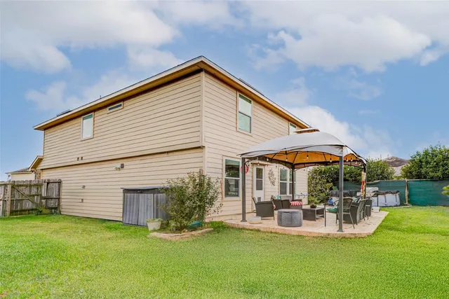 a bedroom with a bed and a lamp