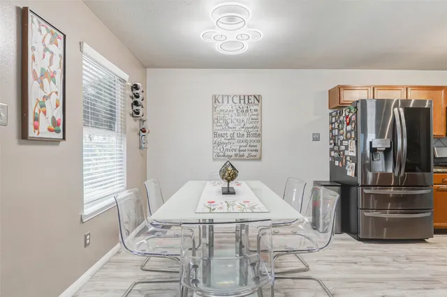 a close view of dining table chairs and entryway