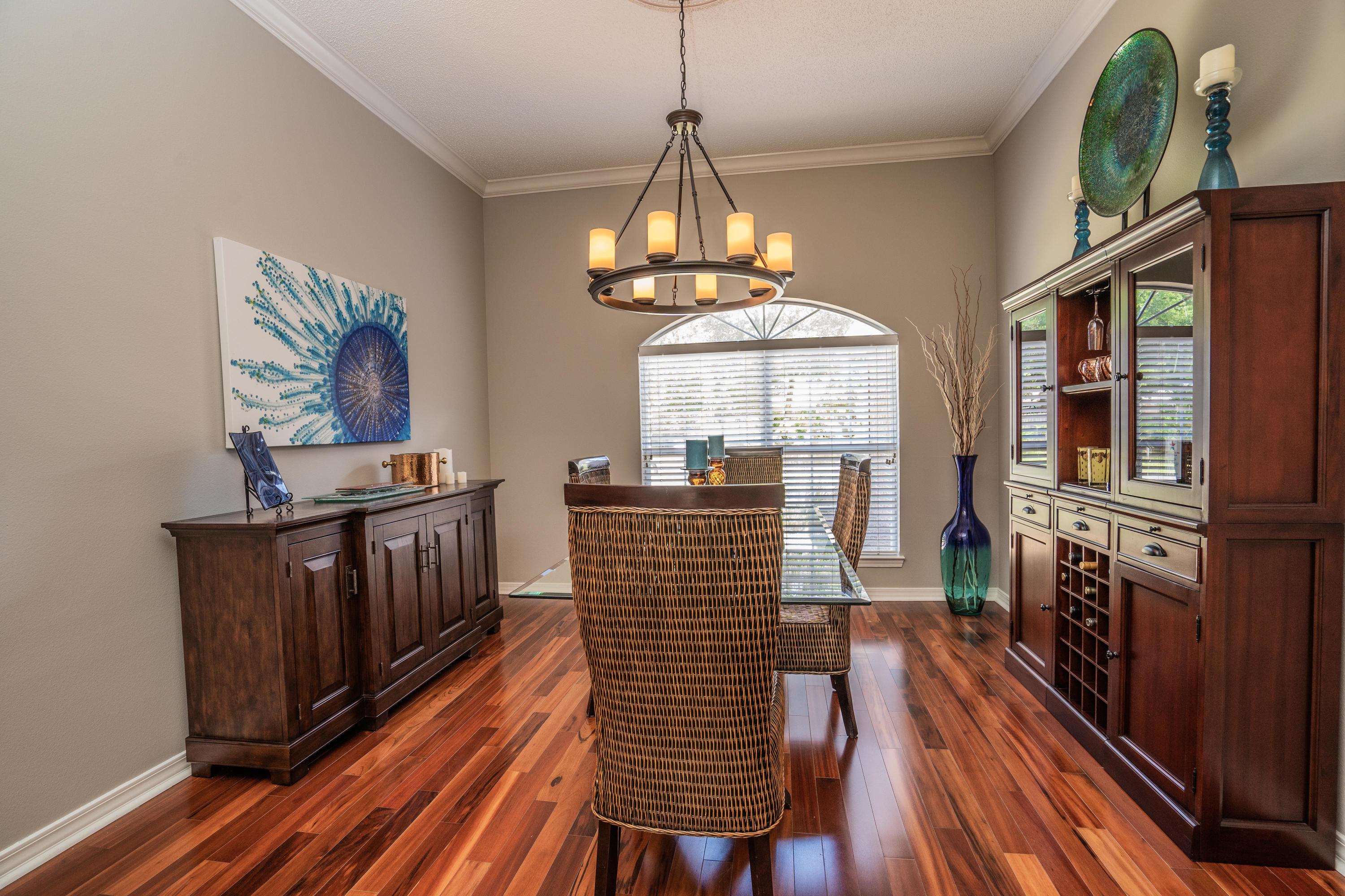 4258 Shadow Lane Niceville, FL 32578 - Photo 14 of 36 a view of a dining room with furniture window and wooden floor
