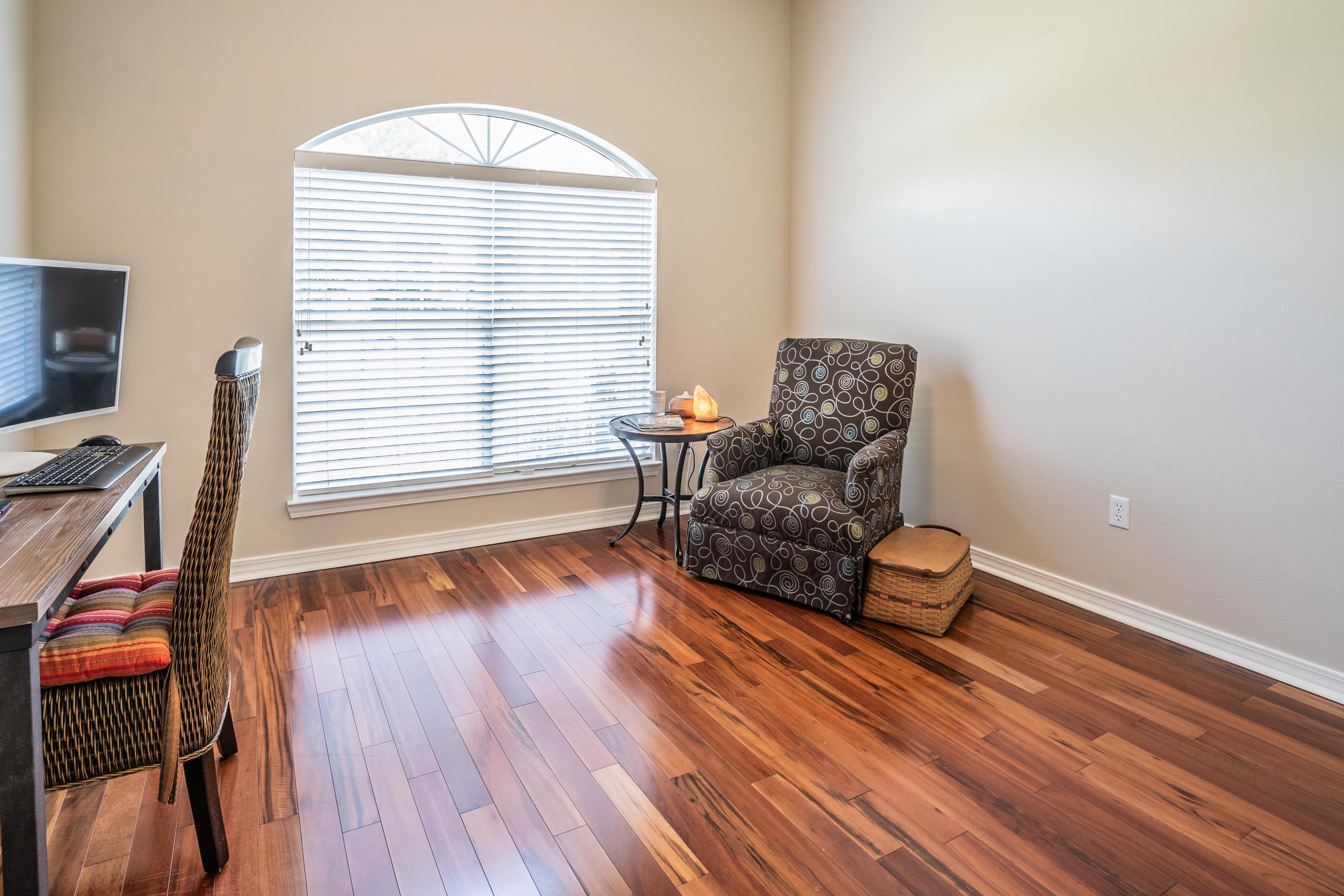 4258 Shadow Lane Niceville, FL 32578 - Photo 20 of 36 a living room with furniture and a wooden floor