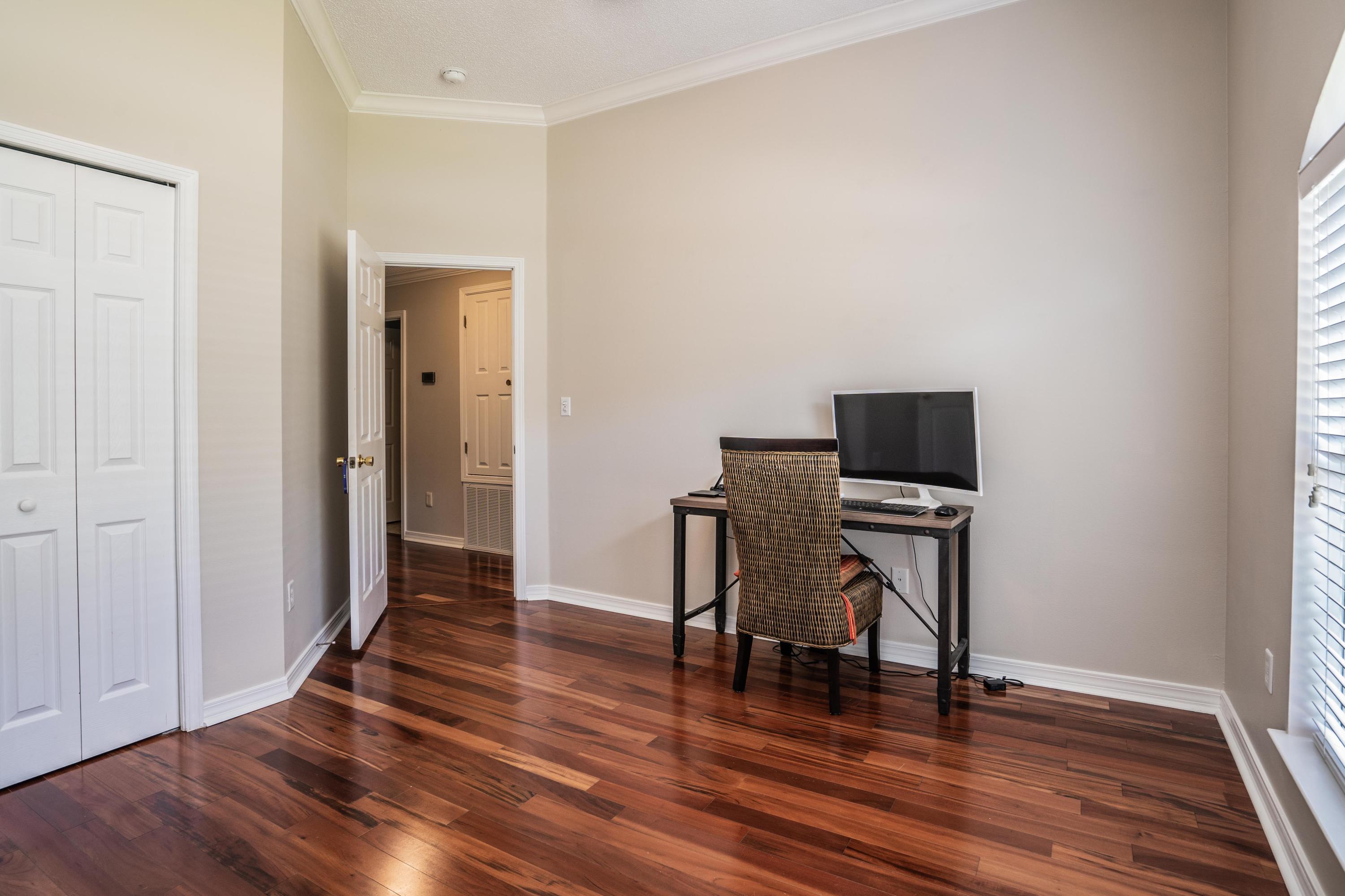 4258 Shadow Lane Niceville, FL 32578 - Photo 21 of 36 a view of a workspace with furniture and wooden floor