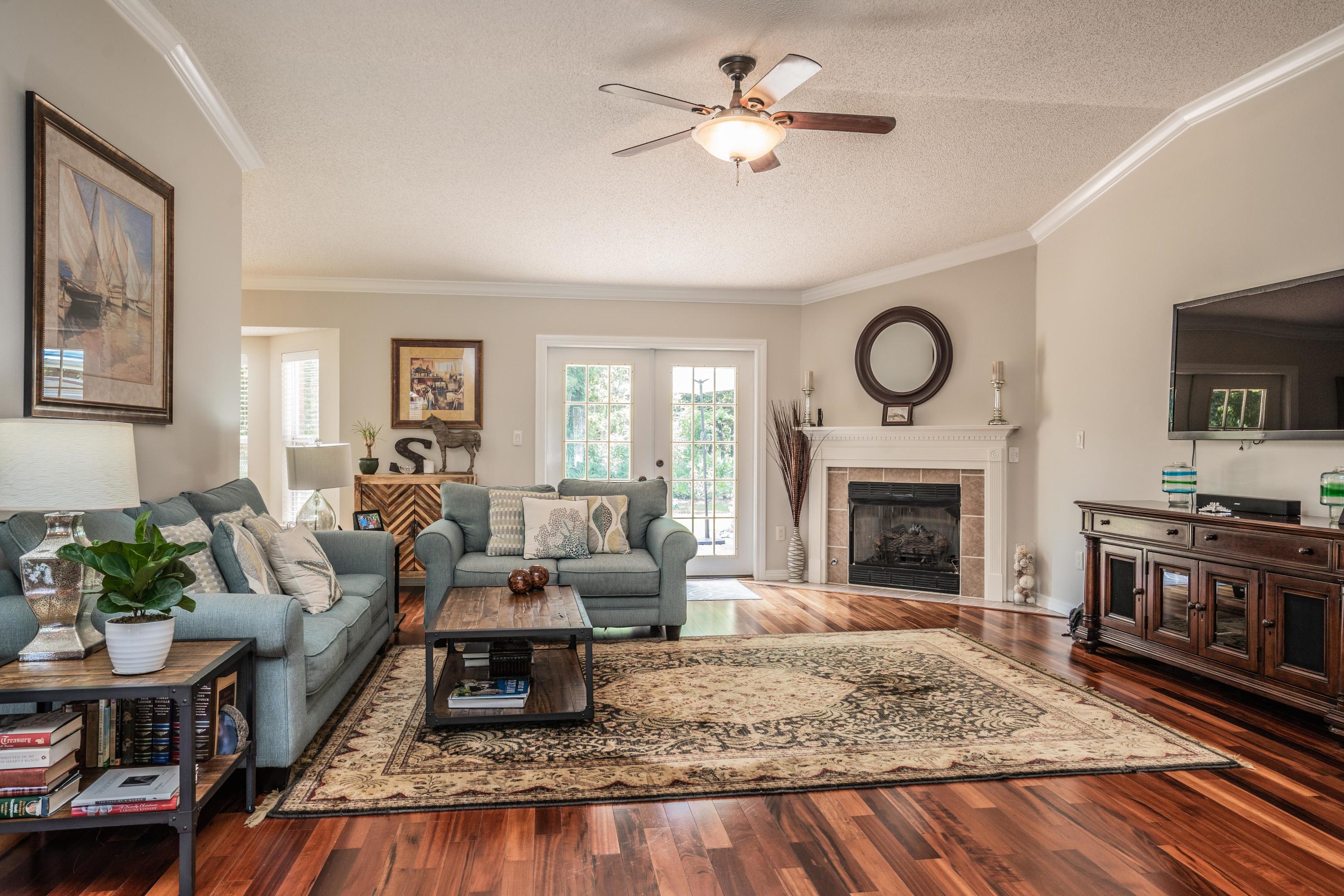 4258 Shadow Lane Niceville, FL 32578 - Photo 6 of 36 a living room with furniture and a fireplace