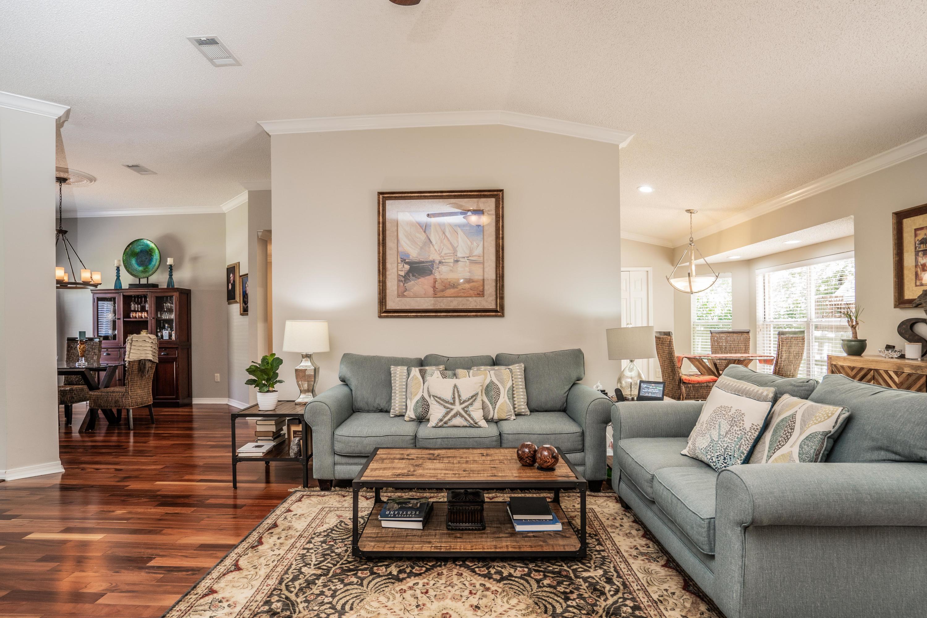 4258 Shadow Lane Niceville, FL 32578 - Photo 7 of 36 a living room with furniture and wooden floor