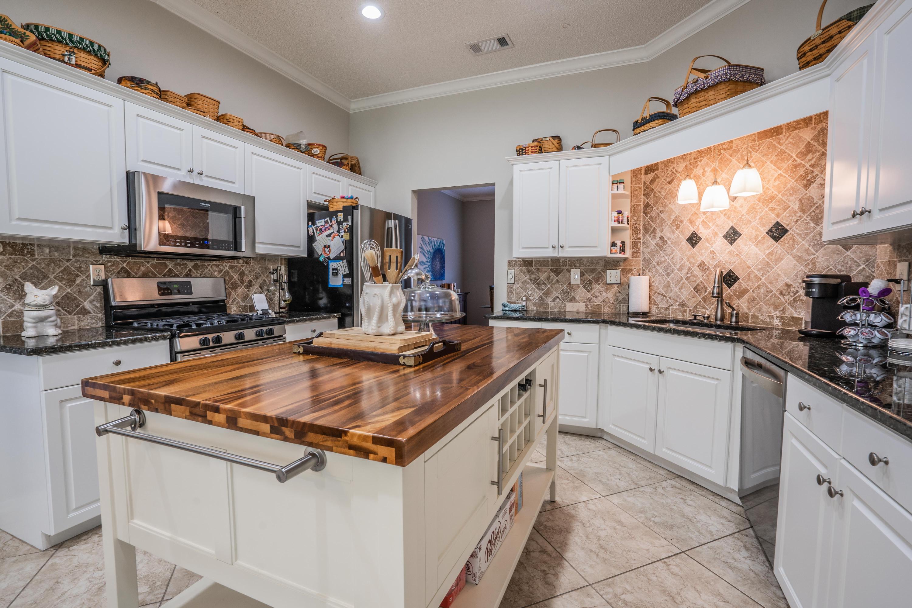 4258 Shadow Lane Niceville, FL 32578 - Photo 10 of 36 a kitchen with stainless steel appliances granite countertop a sink stove and cabinets