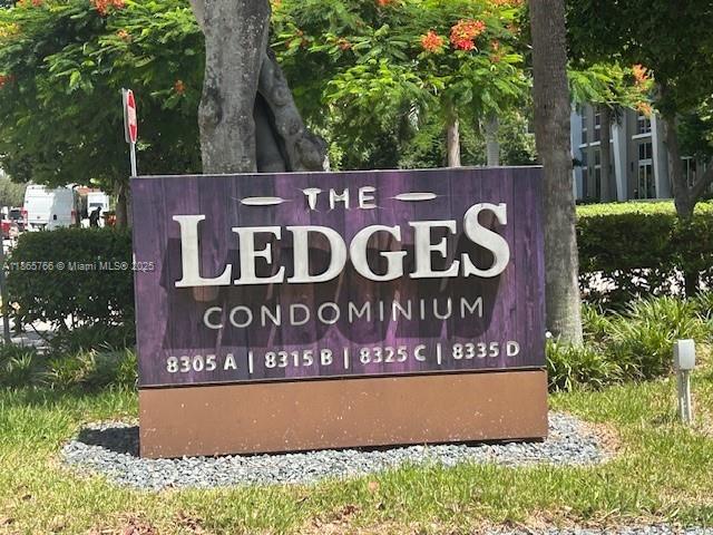 8325 Southwest 72nd Avenue, Unit 205C Miami, FL 33143 - Photo 1 of 14 a sign that is sitting on a wooden wall