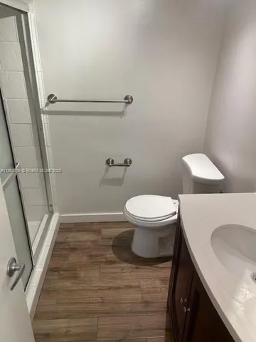 a bathroom with a toilet and a sink