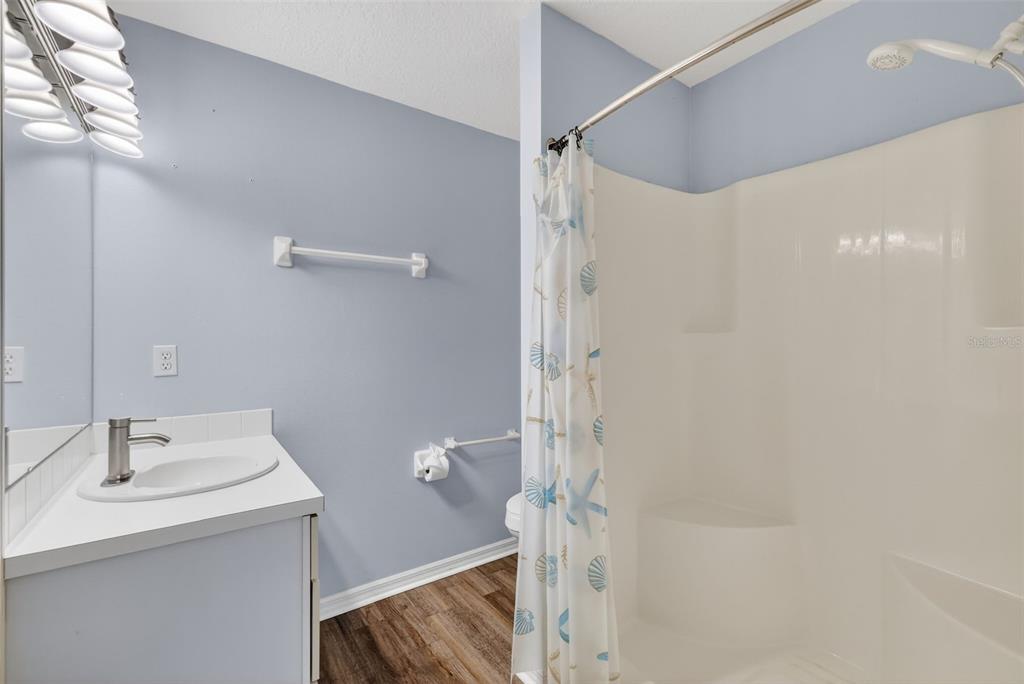 579 Juniper Way Tavares, FL 32778 - Photo 20 of 46 a bathroom with a sink a toilet and shower