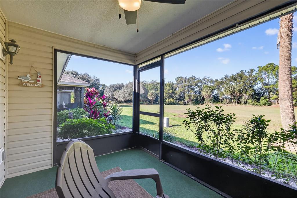 579 Juniper Way Tavares, FL 32778 - Photo 30 of 46 a view of a porch and dining table