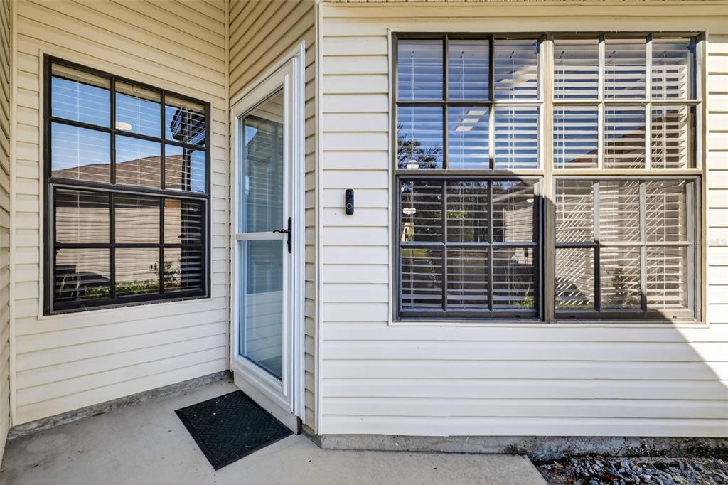 579 Juniper Way Tavares, FL 32778 - Photo 3 of 46 a view of a balcony with a large window