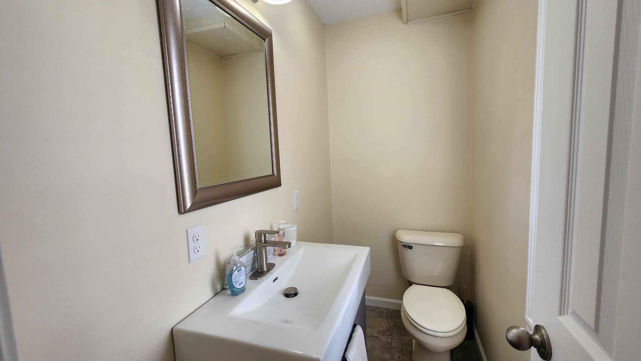 281 Bill Hunter Road Celina, TN 38551 - Photo 11 of 55 a white toilet sitting next to a bathroom sink