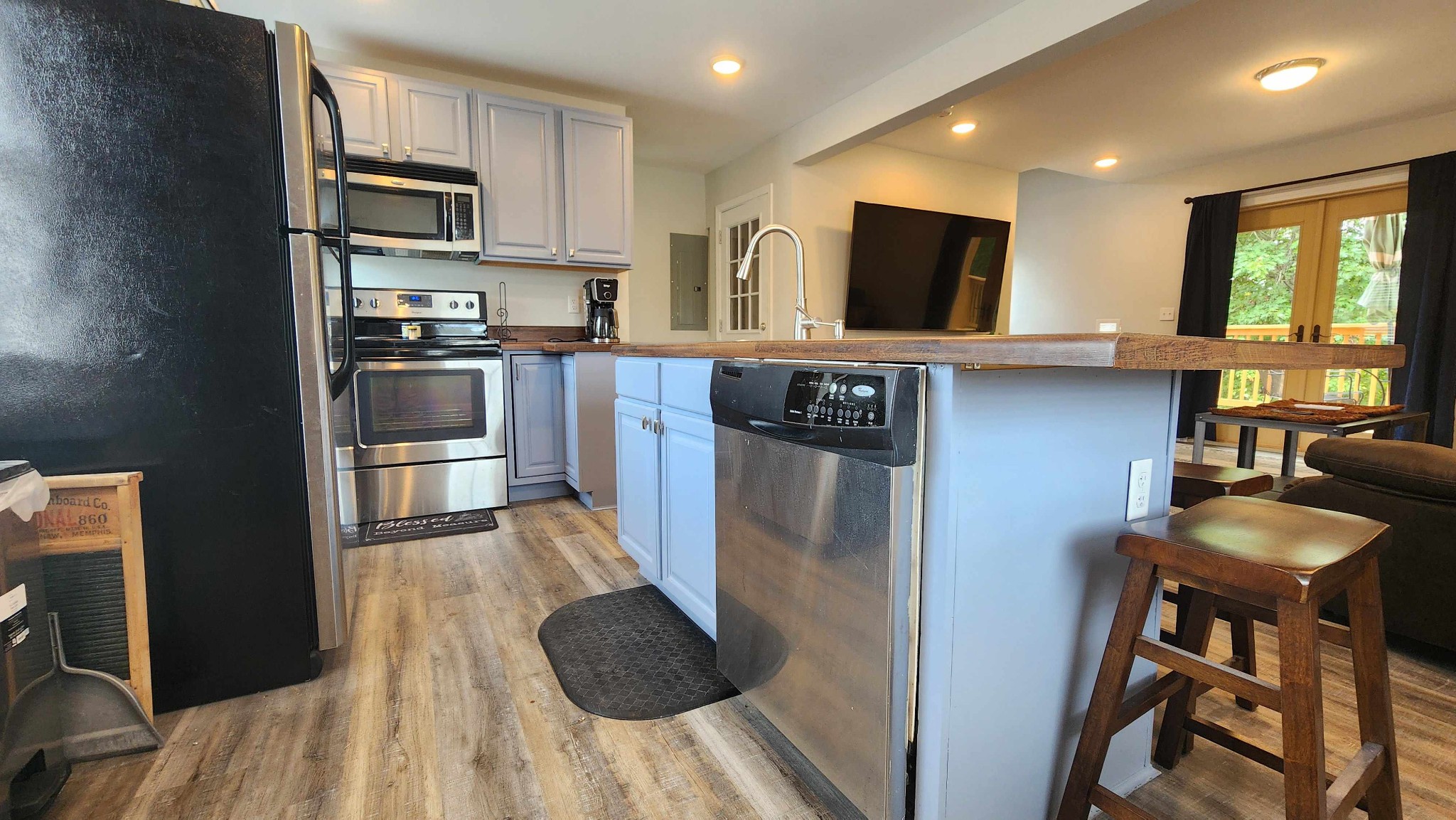 281 Bill Hunter Road Celina, TN 38551 - Photo 12 of 55 a kitchen with stainless steel appliances granite countertop a refrigerator sink and stove