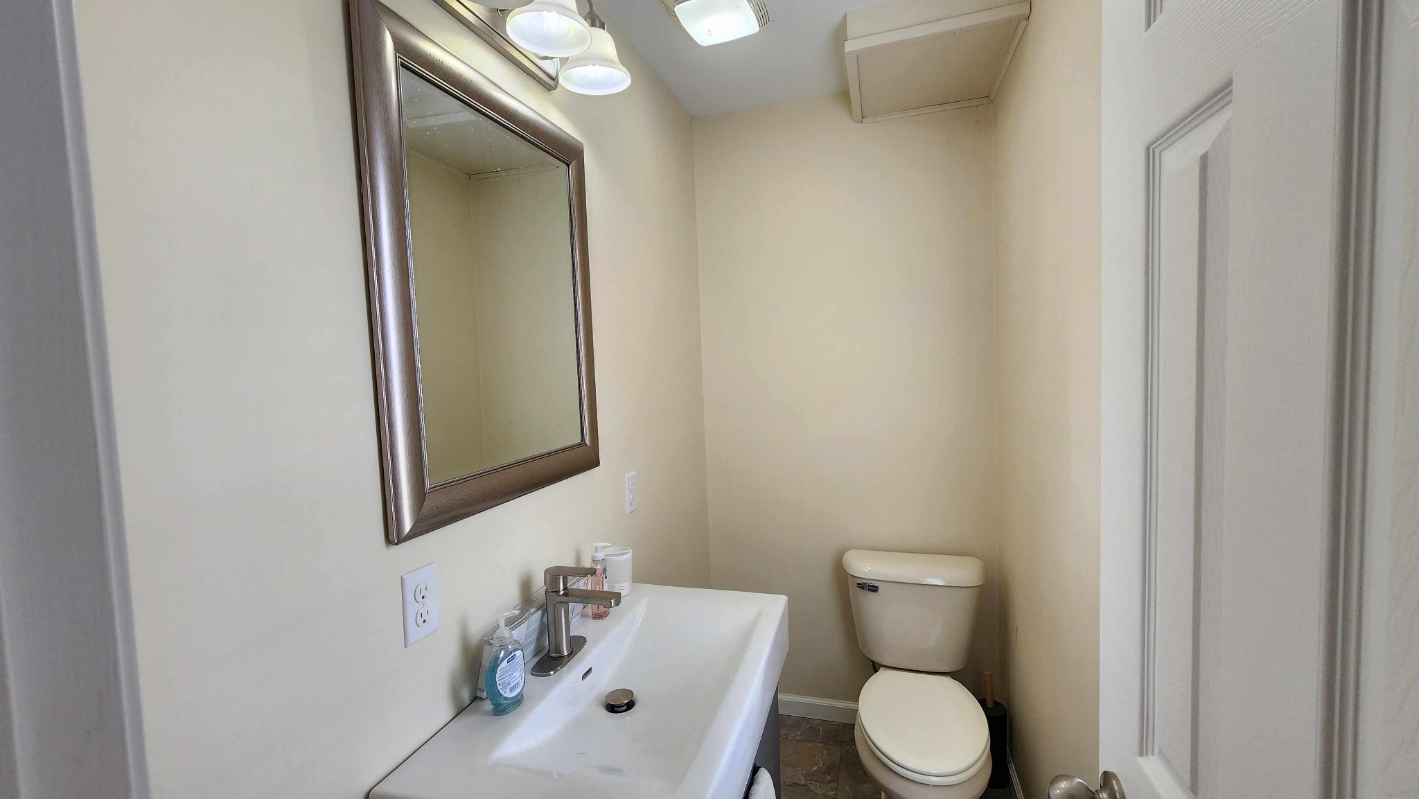 281 Bill Hunter Road Celina, TN 38551 - Photo 16 of 55 a white toilet sitting next to a bathroom sink