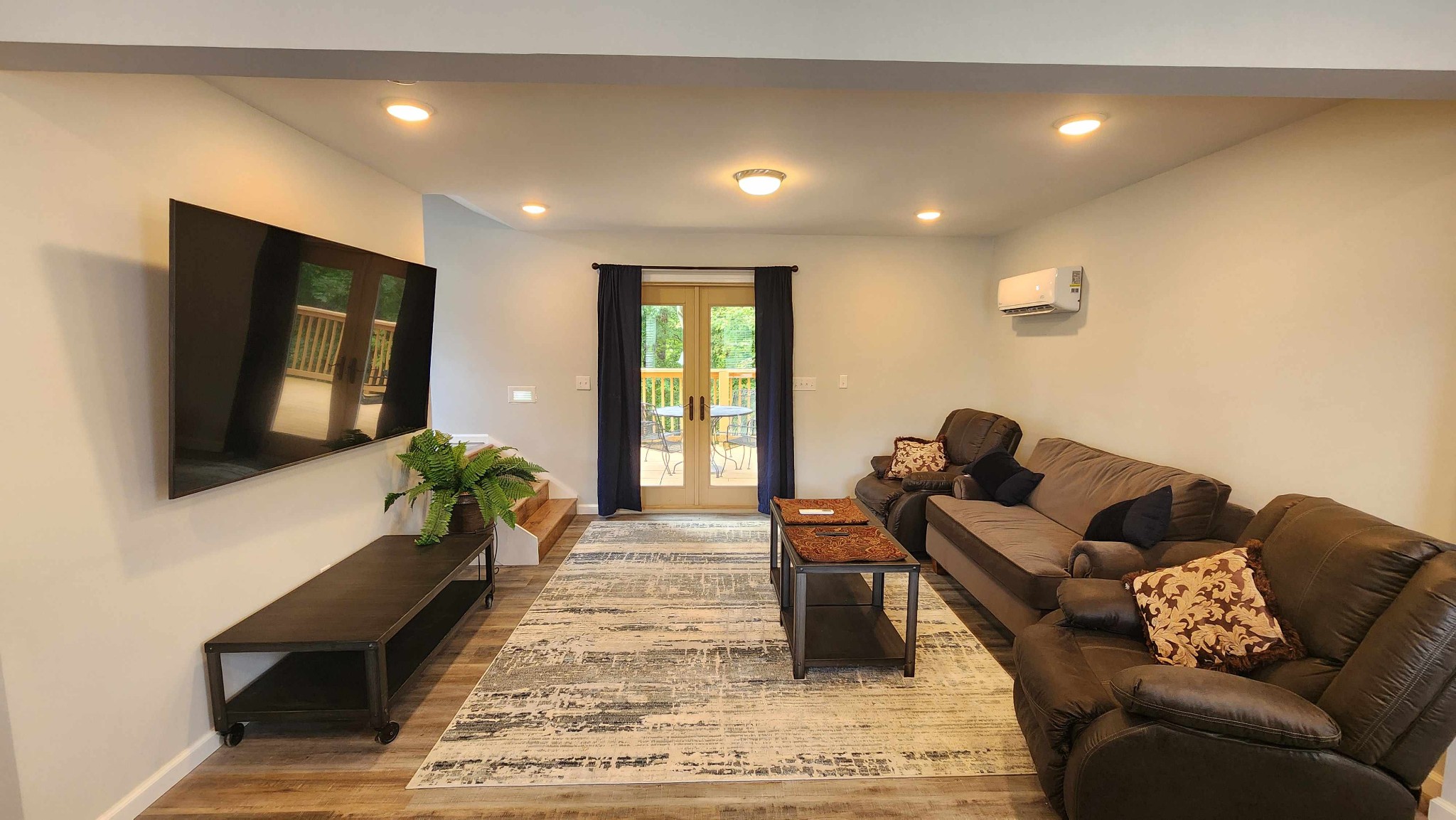 281 Bill Hunter Road Celina, TN 38551 - Photo 19 of 55 a living room with furniture and a flat screen tv