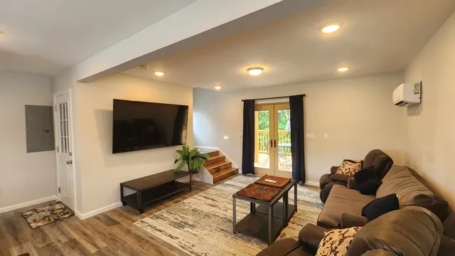 a living room with furniture and a flat screen tv