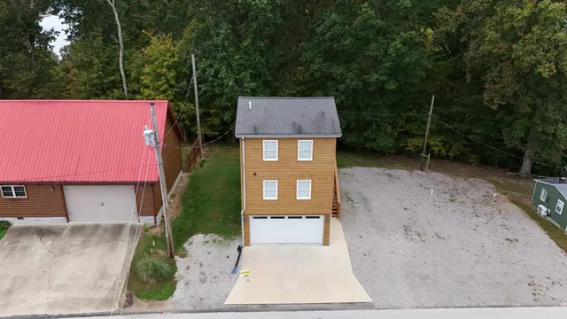 a view of a house with a yard