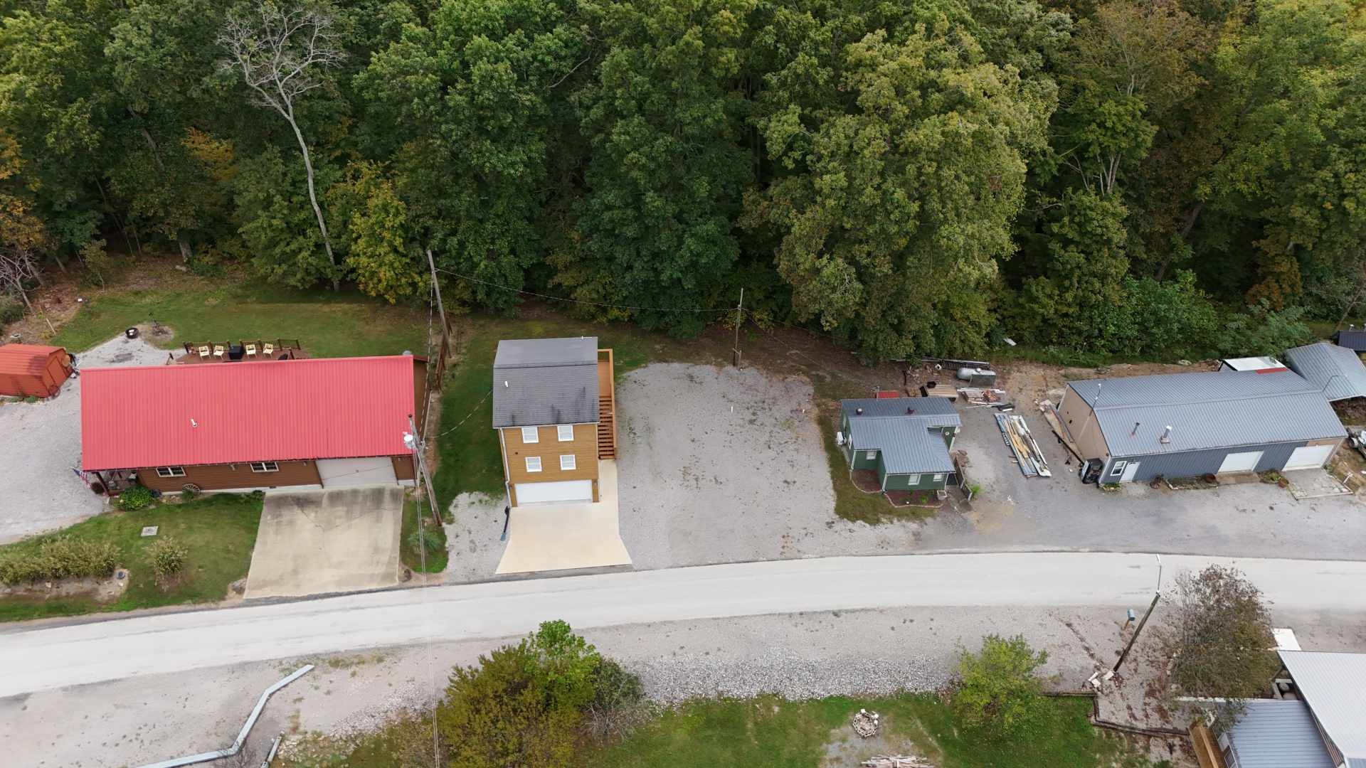 281 Bill Hunter Road Celina, TN 38551 - Photo 27 of 55 an aerial view of a house with garden space and street view