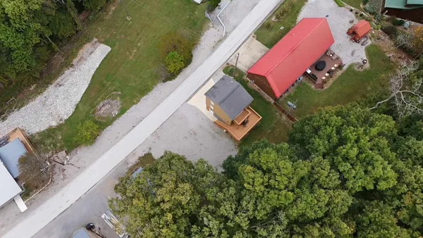 an aerial view of residential houses and outdoor space
