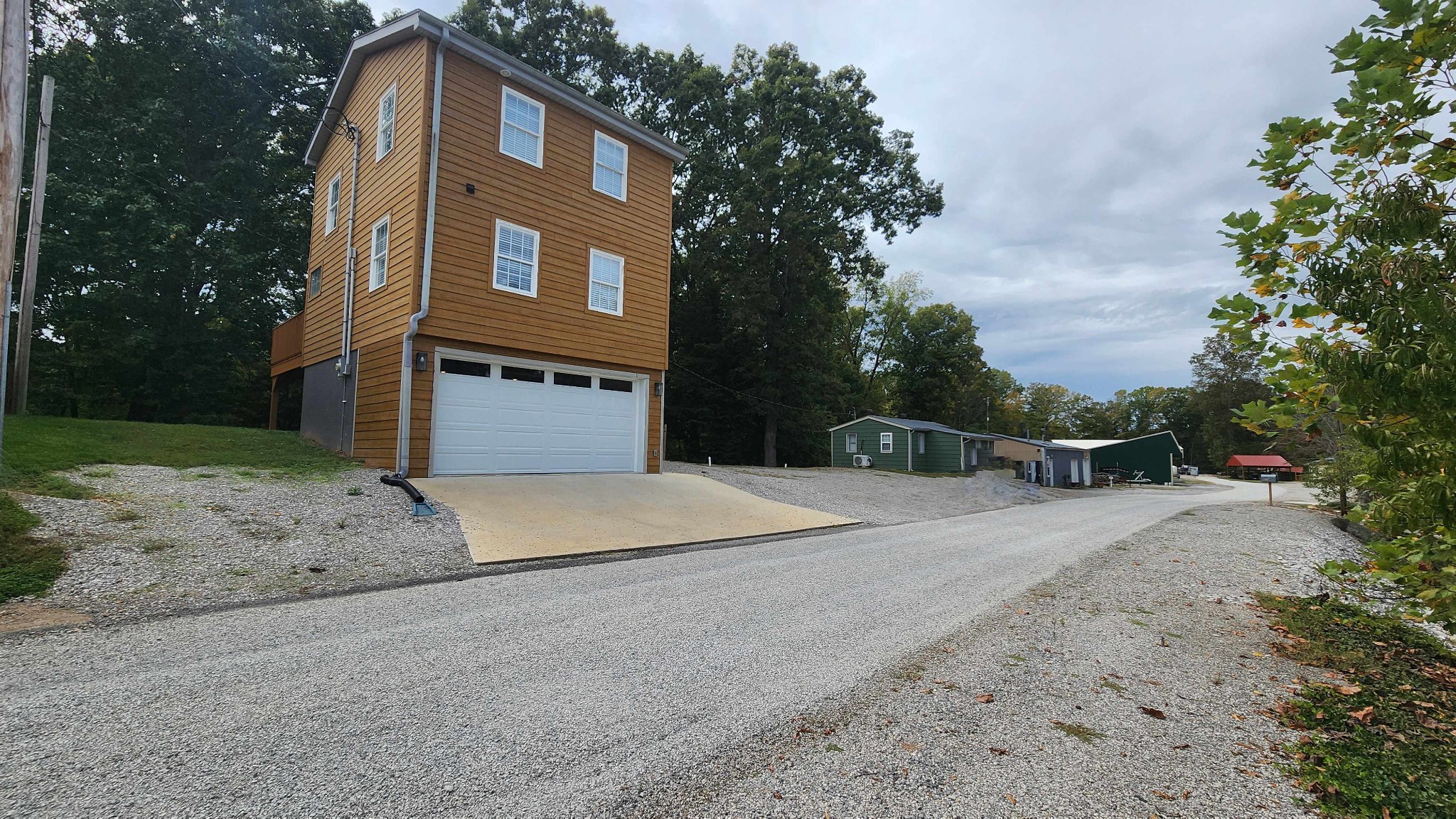 281 Bill Hunter Road Celina, TN 38551 - Photo 41 of 55 a front view of a house with a yard and garage